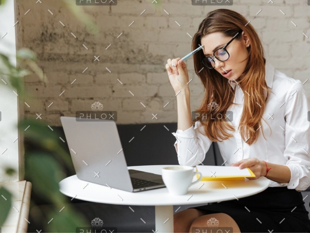 demo-attachment-1151-thoughtful-business-woman-indoors-using-laptop-P5HYUQX